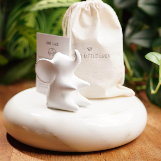 white lucky elephant figurine. for good luck