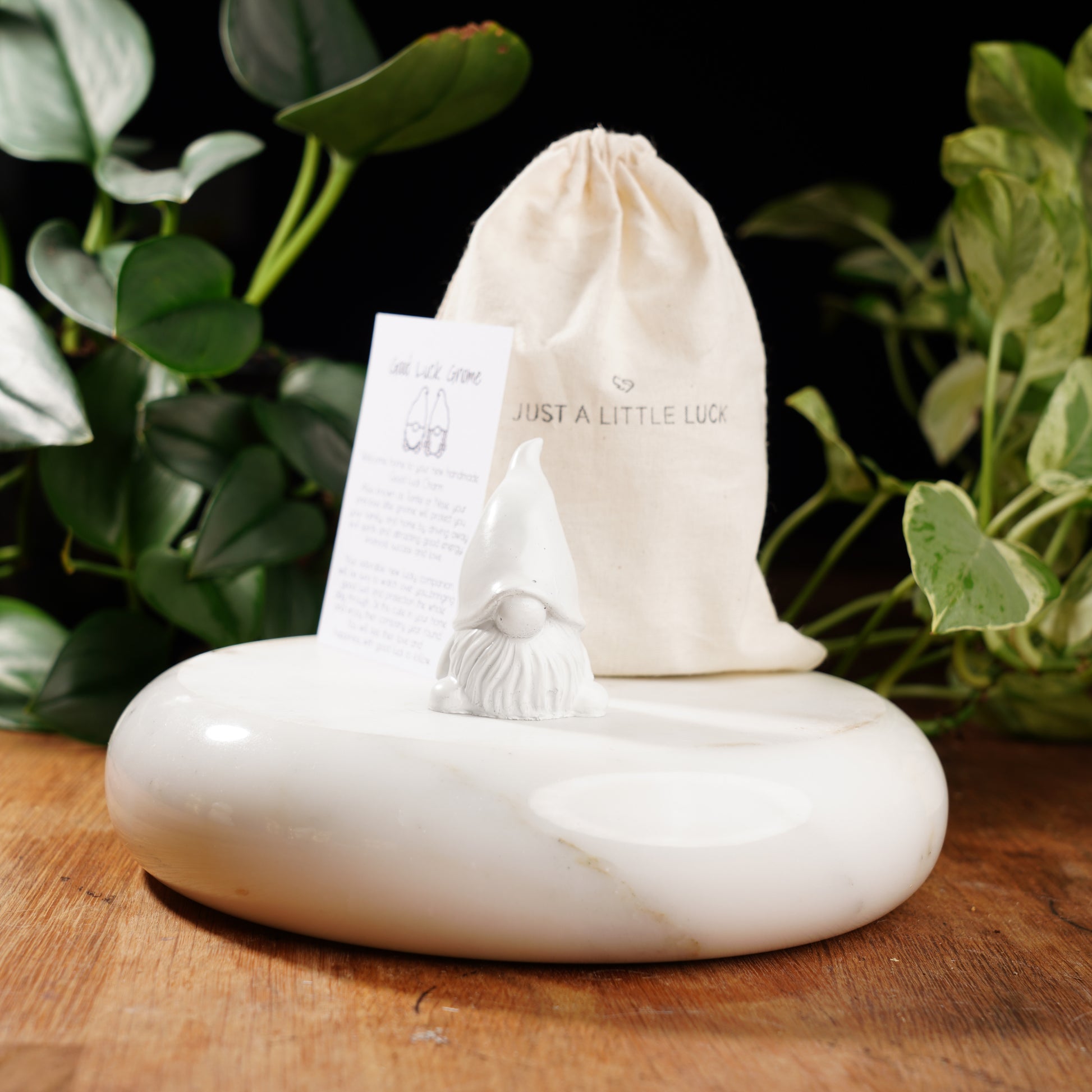 white gnome figurine for good luck
