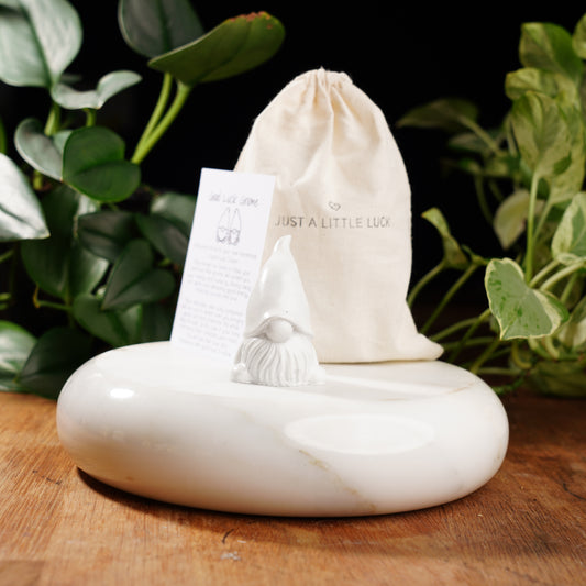 white gnome figurine for good luck